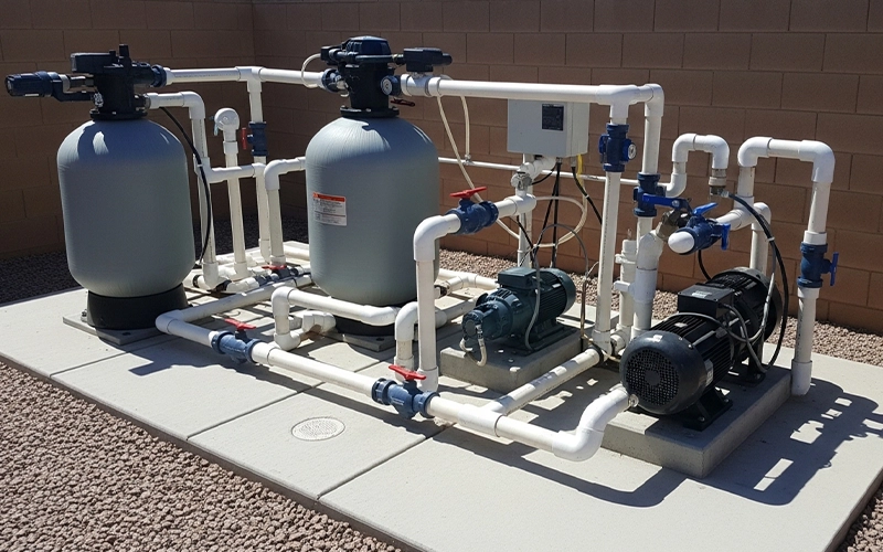 Clean Scottsdale pool equipment pad with pump and filter system showing reliable operation.