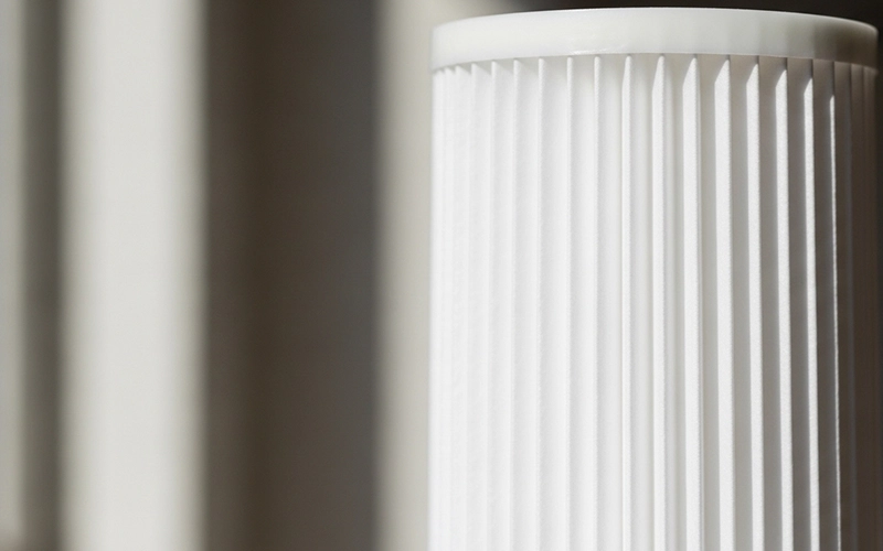 Clean cartridge filter pleats showing cleaner filtration that reduces equipment wear