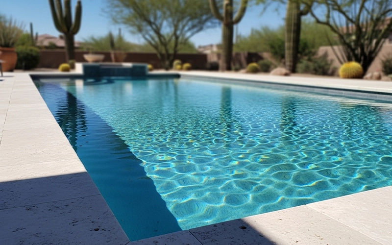 Crystal clear Scottsdale pool water with calm ripples showing stable conditions when equipment works