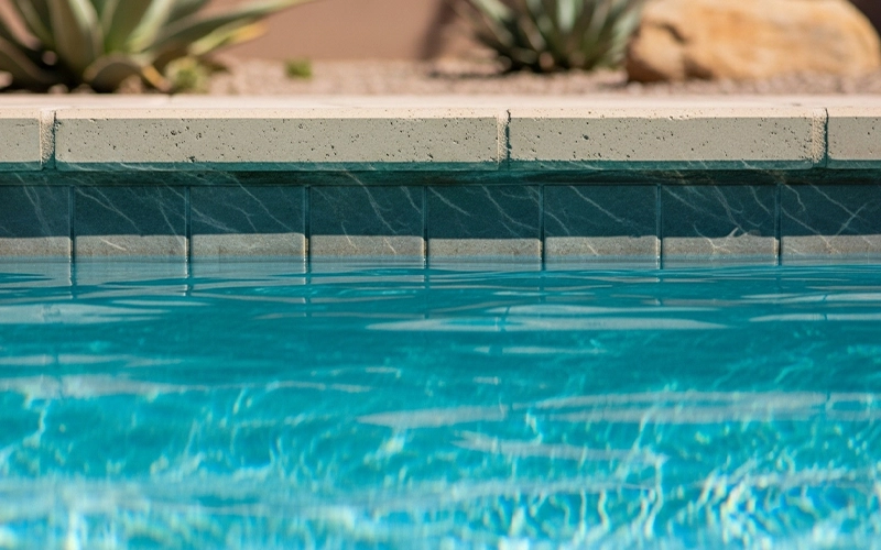 Stable pool waterline aligned with tile edge showing consistent water level in Scottsdale, AZ