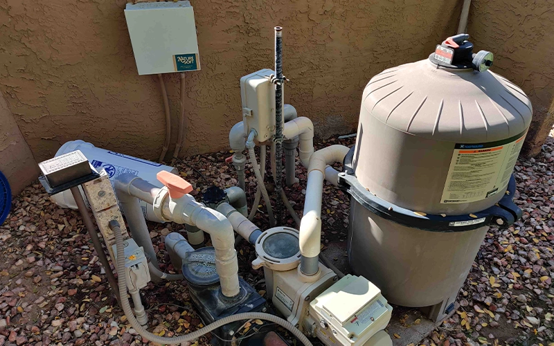 Hayward pool filter, pump, and Nature Soft system installed on a residential pool equipment pad in Arizona.