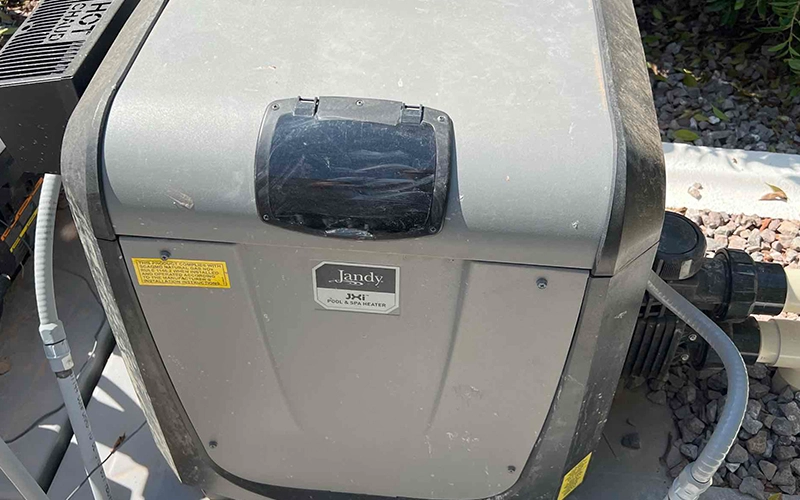 Professional pool heater repair service in Mesa, AZ featuring a Jandy JXi pool and spa heater to restore reliable and efficient pool heating.