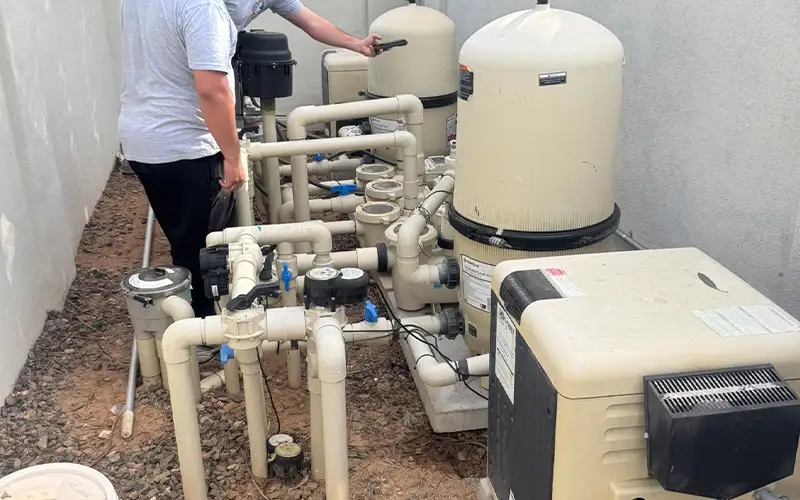 Pool equipment system with pumps, filters, and plumbing inspected during professional pool maintenance service in Arizona