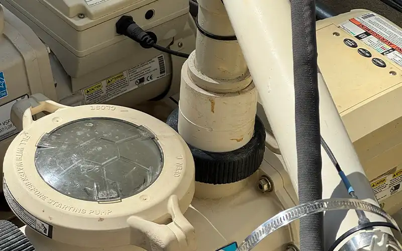 Pool equipment inspection in Scottsdale and Mesa Arizona showing pump system checks during a professional pool service visit