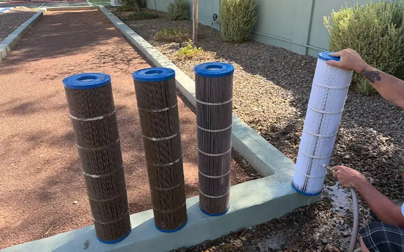 Pool filter cleaning service in Scottsdale and Mesa Arizona with cartridge filters being washed to improve filtration performance and reduce equipment strain