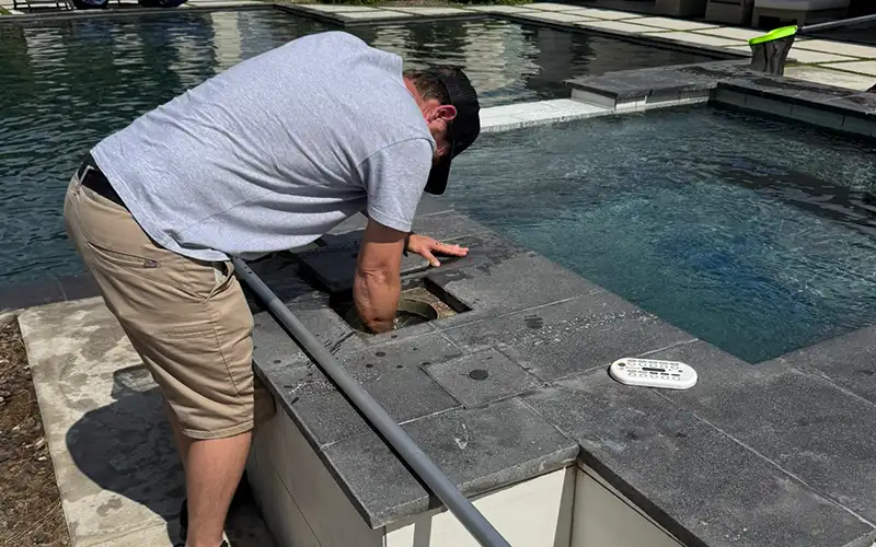 Pool inspection service in Scottsdale and Mesa Arizona with technician checking pool equipment and visible system conditions for repair recommendations