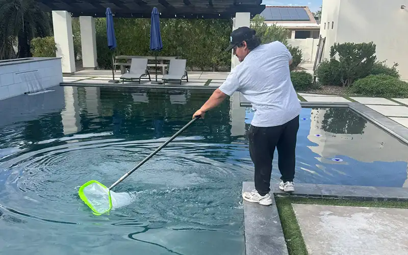 Pool maintenance service in Scottsdale and Mesa Arizona showing professional cleaning to keep pool water stable and ready for use